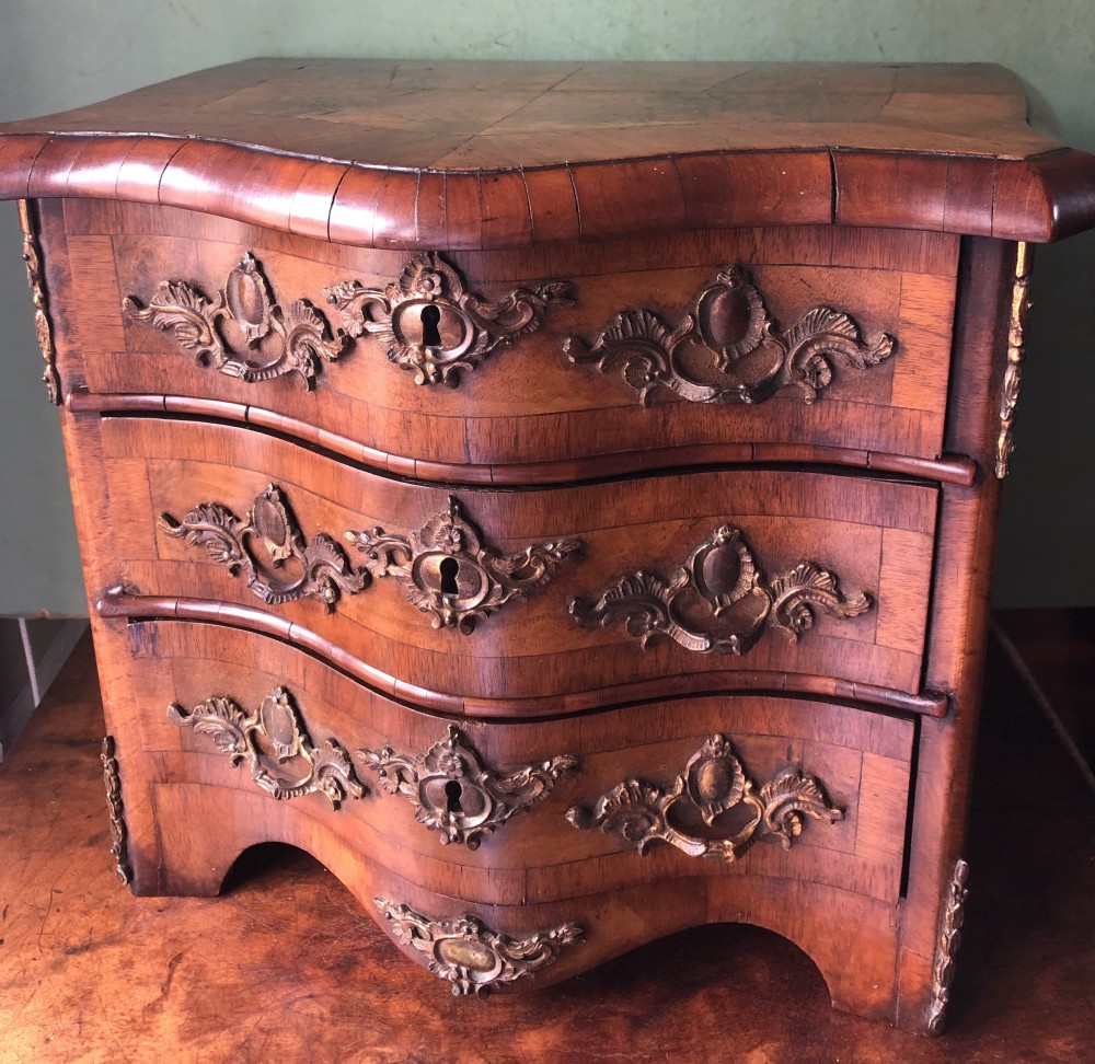 fine quality c19th french miniature walnut serpentine commode with rococo ormolu handles and mounts