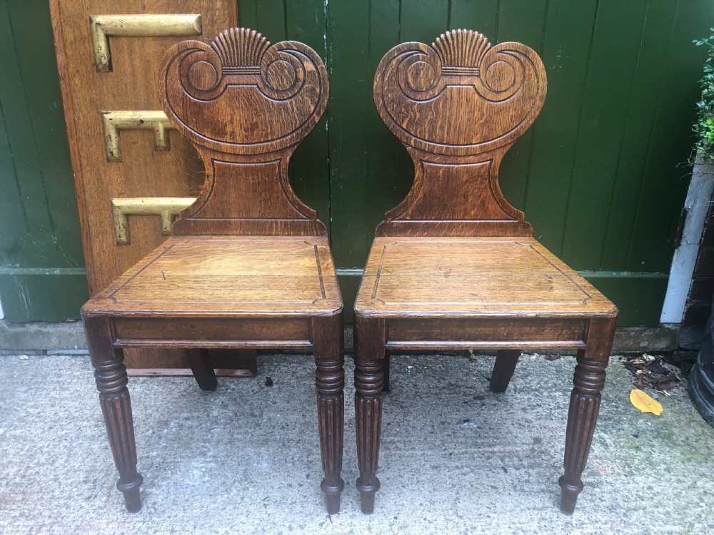 pair of early c19th regency period oak hall or footmans chairs by gillows of lancaster