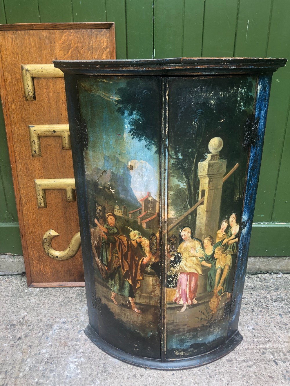 c18th dutch bowfront hanging corner cupboard decorated with an exotic figural scene