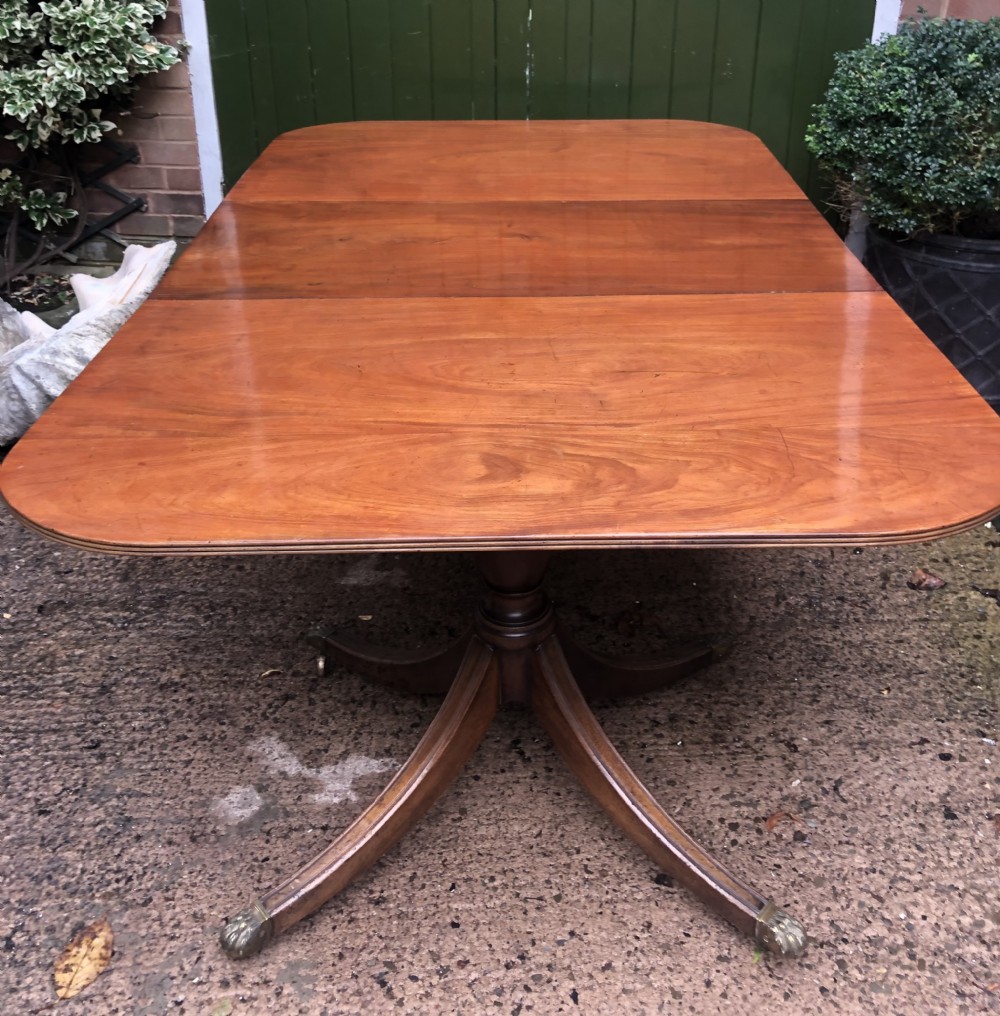 early c20th regency style mahogany 2pillar dining table with an additional extension leaf