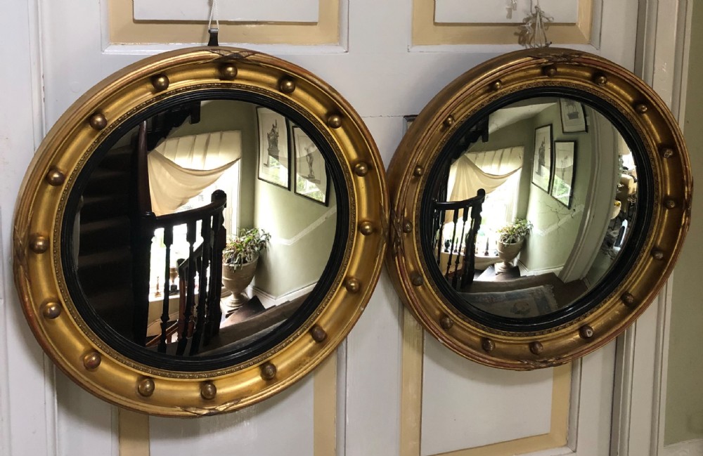 decorative matched pair of early c20th regency style giltwood framed convex mirrors