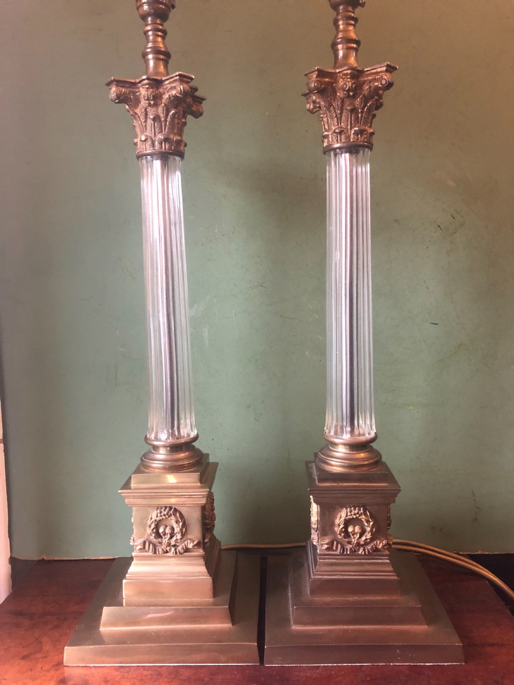 pair of early c20th giltbrass and glass corinthian column table lamps