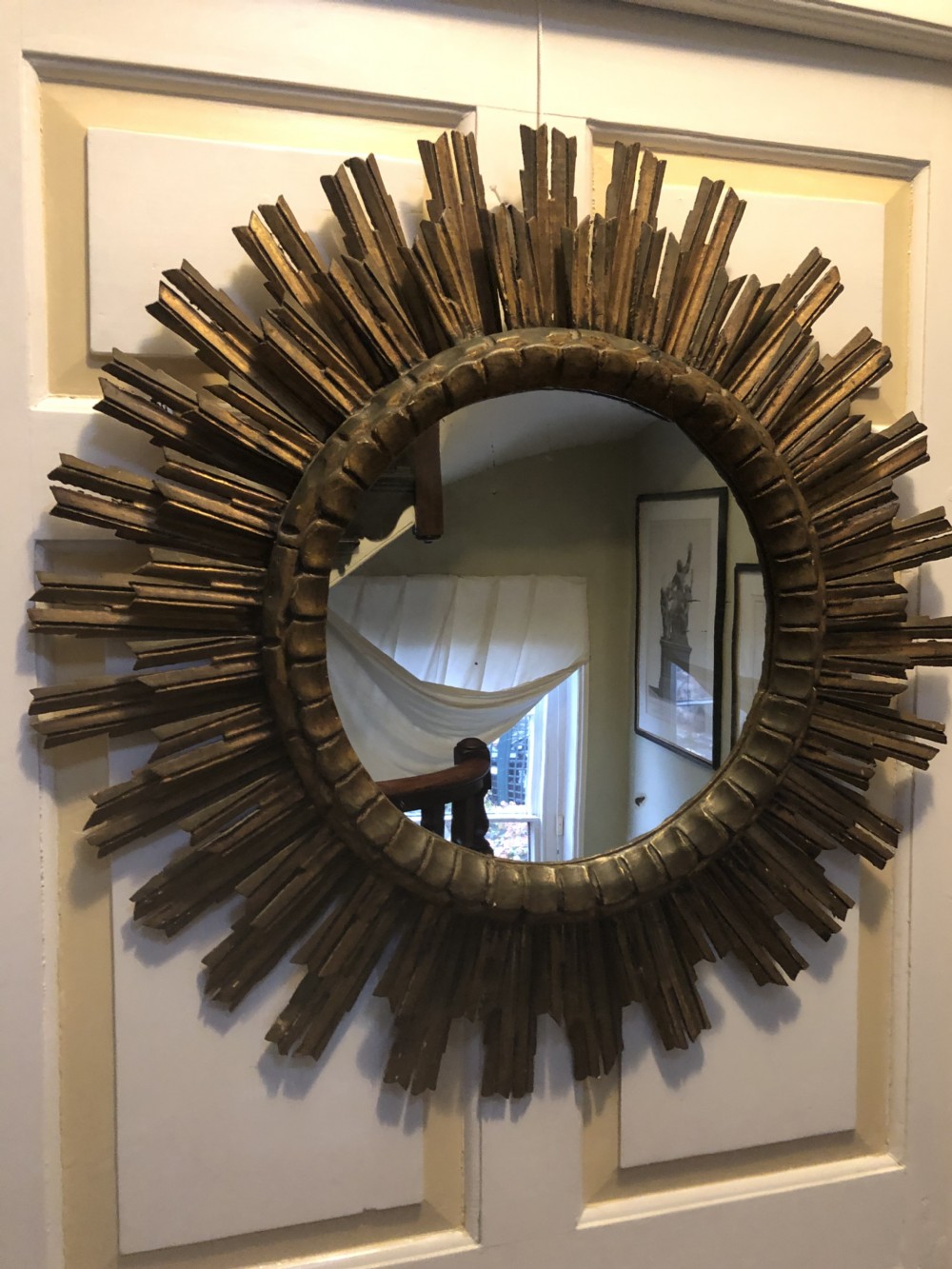 highly decorative early c20th carved giltwood sunburst frame circular mirror