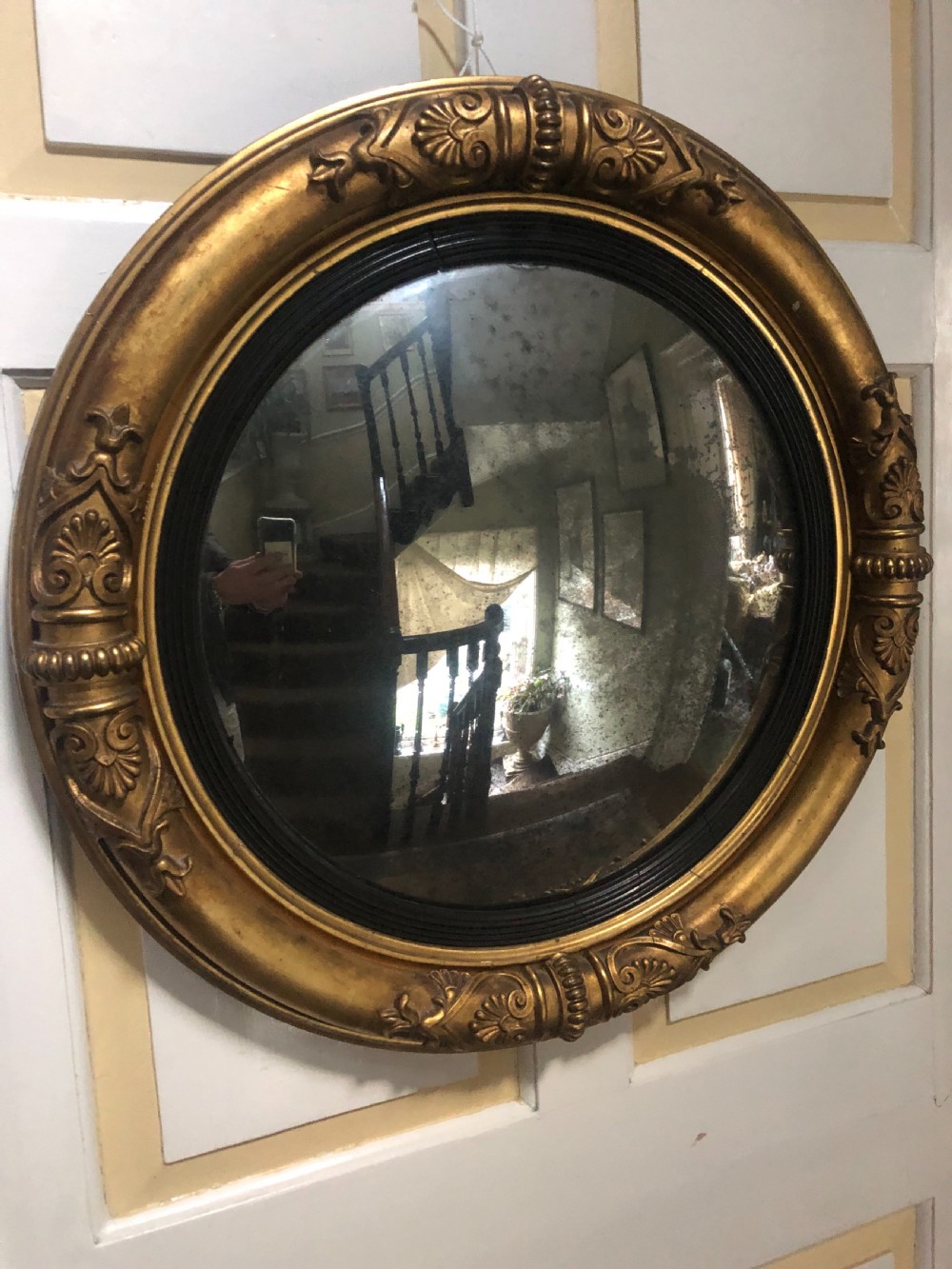 early c19th regency period giltwood frame convex plate mirror of grecian revival design