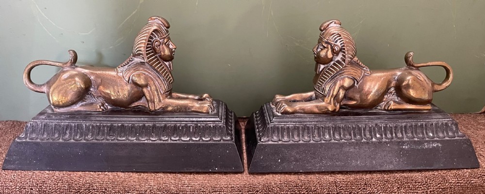 pair of decorative mid c19th brass and castiron sphinx andirons
