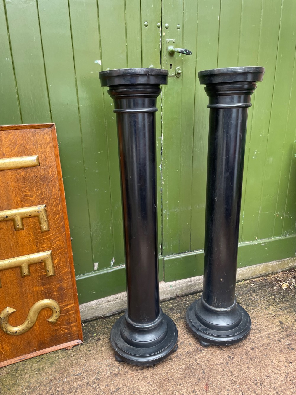 pair of late c19th ebonised mahogany display columns