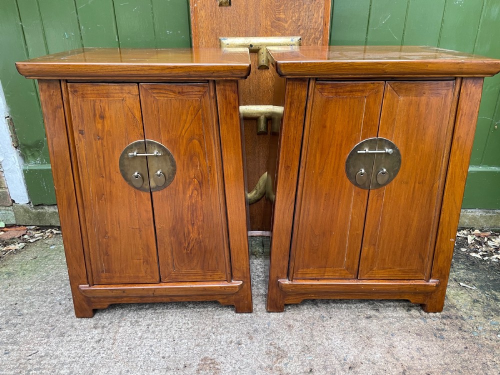 pair of early c20th chinese republic period hardwood bedside cupboards