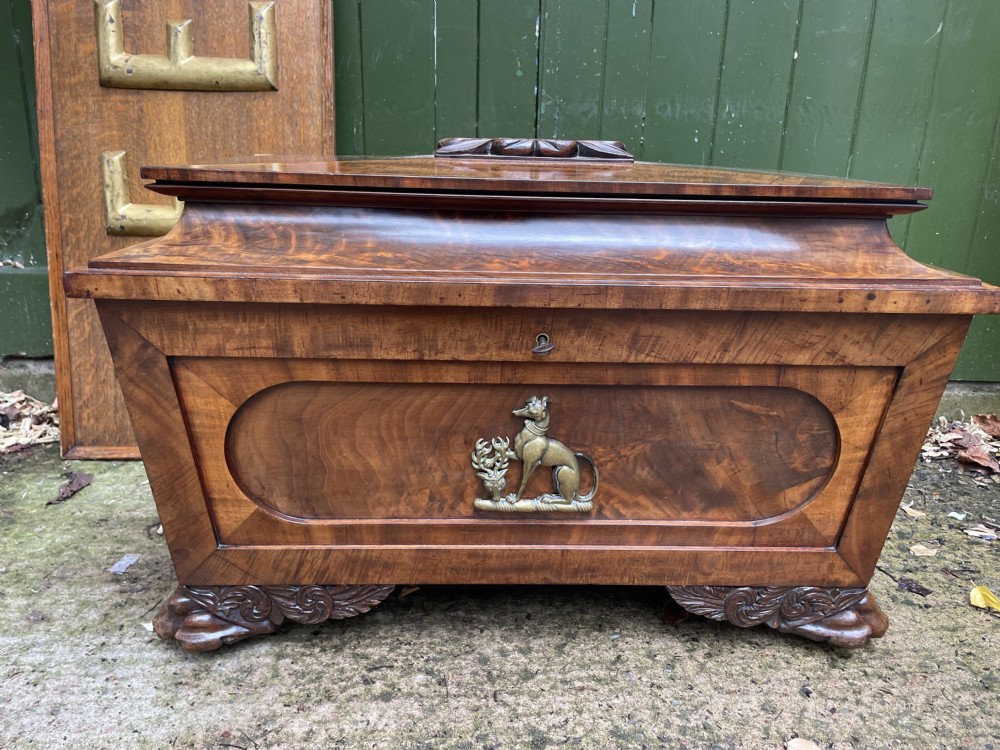 early c19th regency period brassmounted mahogany cellarette or winecooler of classical sarcophagus form with a noble armorial