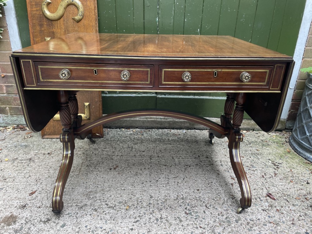 elegant early c19th regency period brassinlaid and brassmounted mahogany dropleaf sofa table