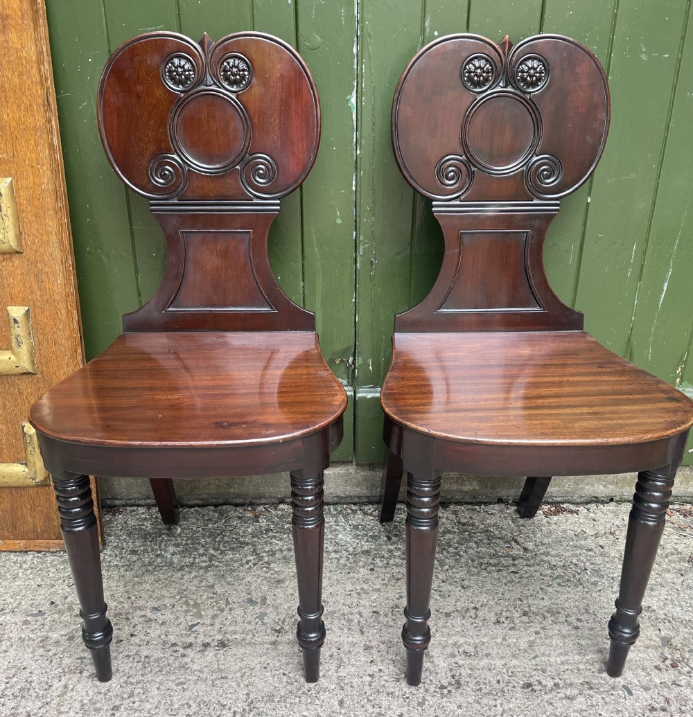 elegant pair of early c19th regency period mahogany hall or footmans chairs