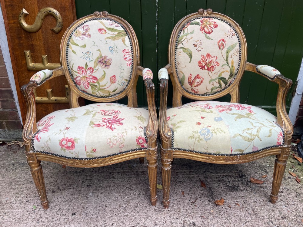 pair of mid c19th french giltwood salon armchairs in the c18th louis xvi style