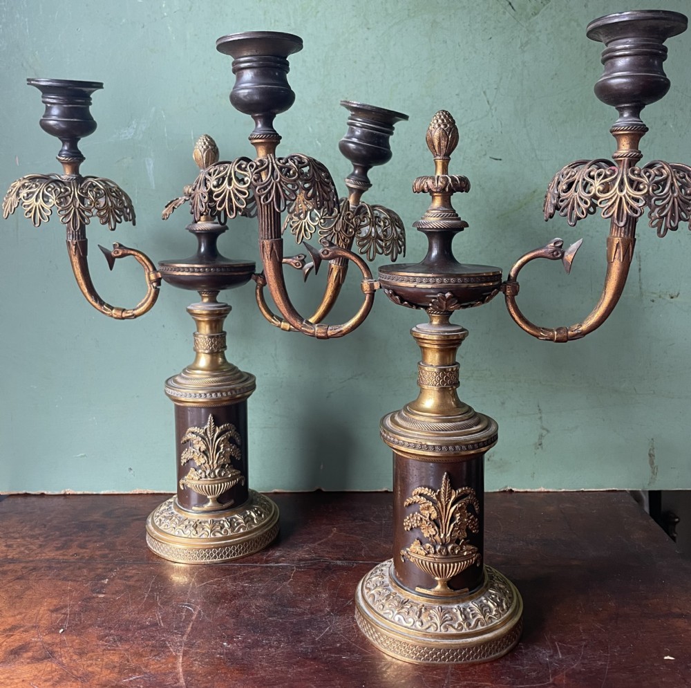 pair of early c19th regency period patinated bronze and ormolu twinbranch candelabras