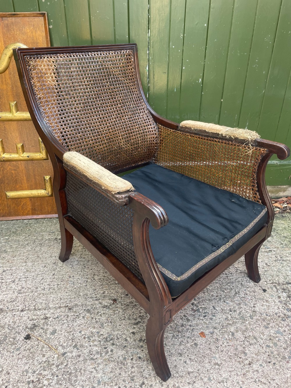 early c19th regency period mahogany framed bergere library armchair