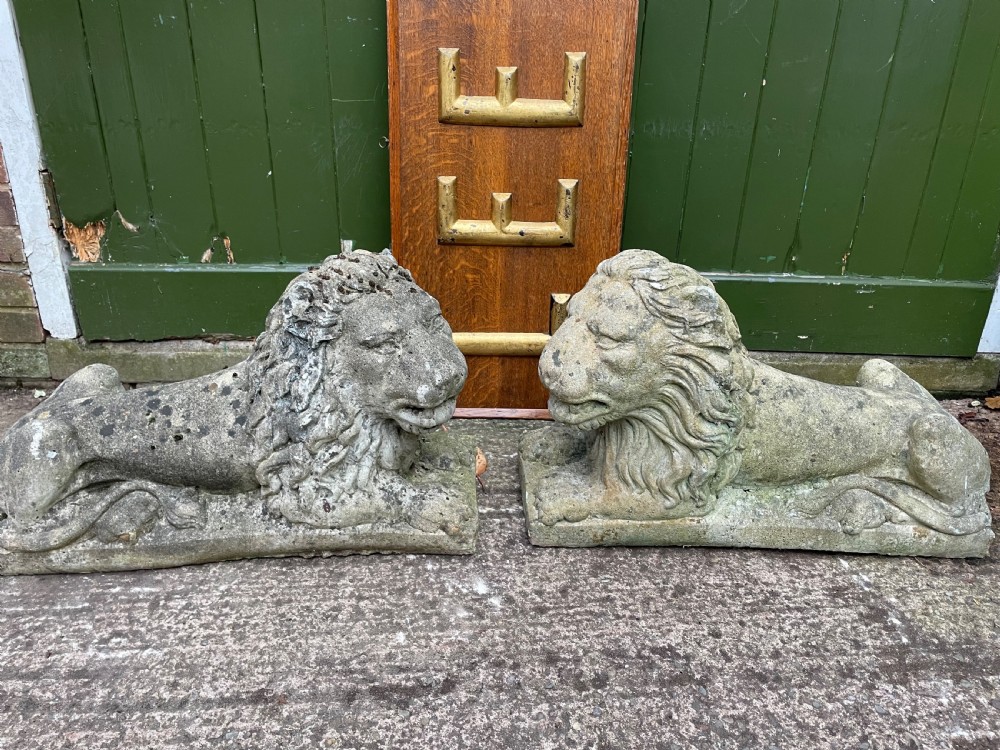 pair of early c20th cast composition stone lions of good large scale