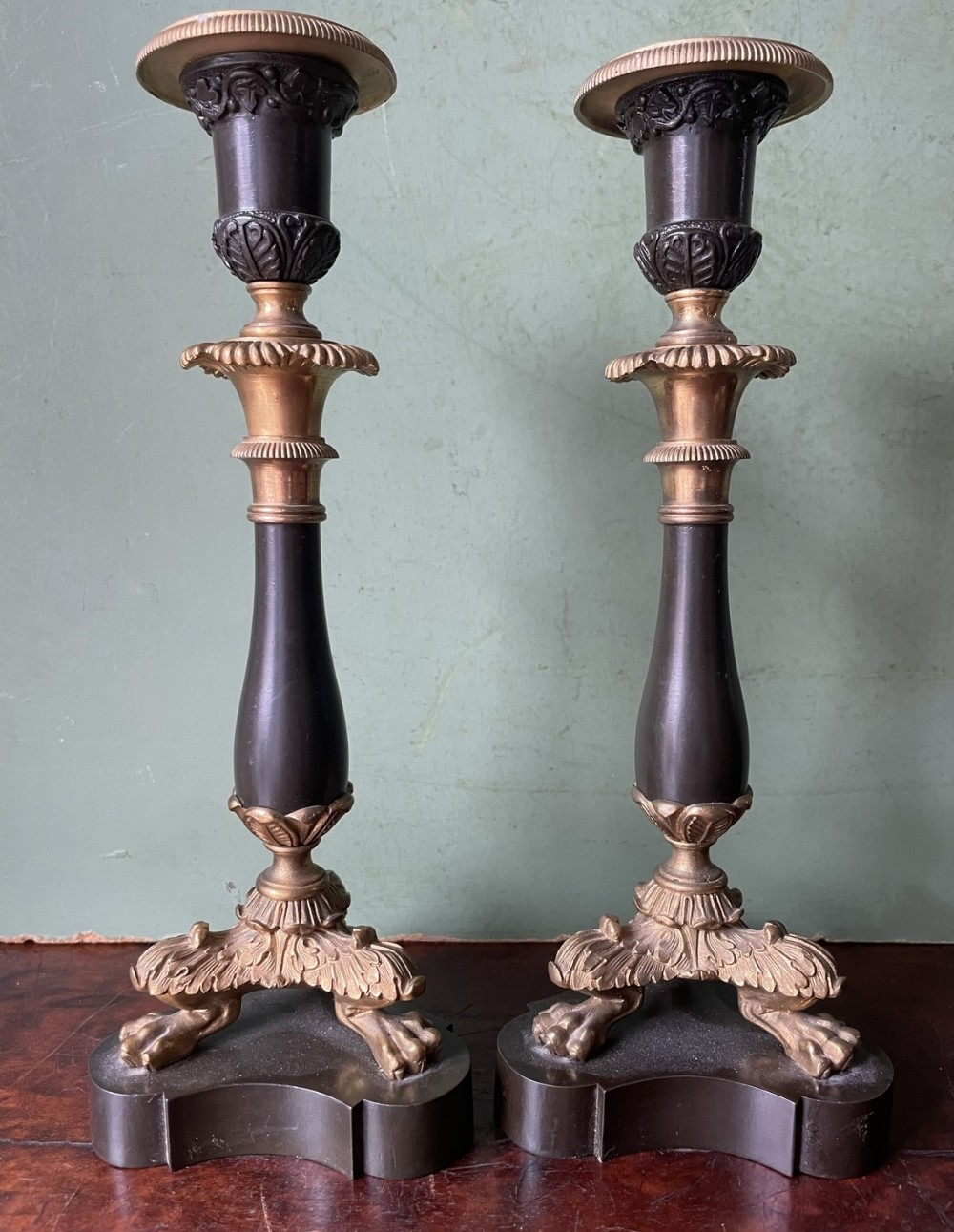 pair of early c19th french charles x period bronze and ormolu candlesticks