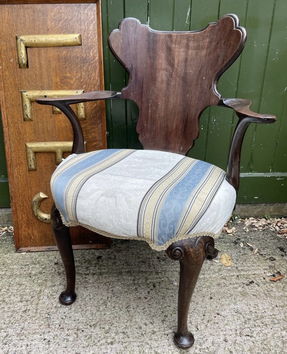 c19th mahogany antiquarian escutcheonback armchair of early c18th george ii period design