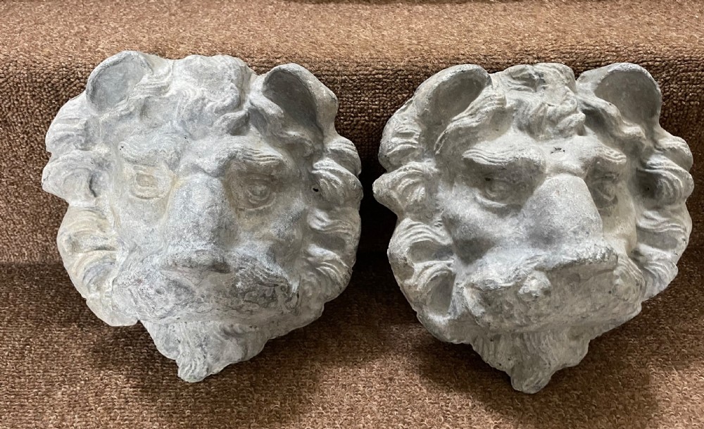 pair of decorative c19th cast lead lions masks