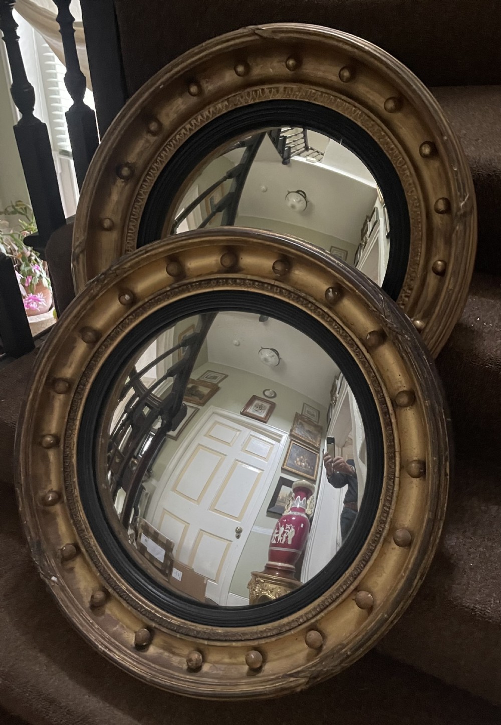 matched pair of early c19th regency period circular giltwood framed convexplate mirrors