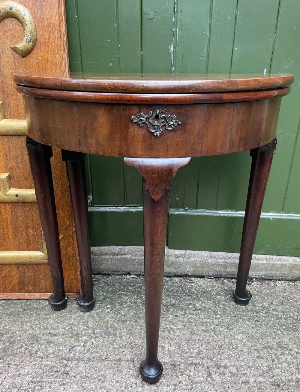 diminutive mid c18th george ii period mahogany demilune foldover top tea or occasional table