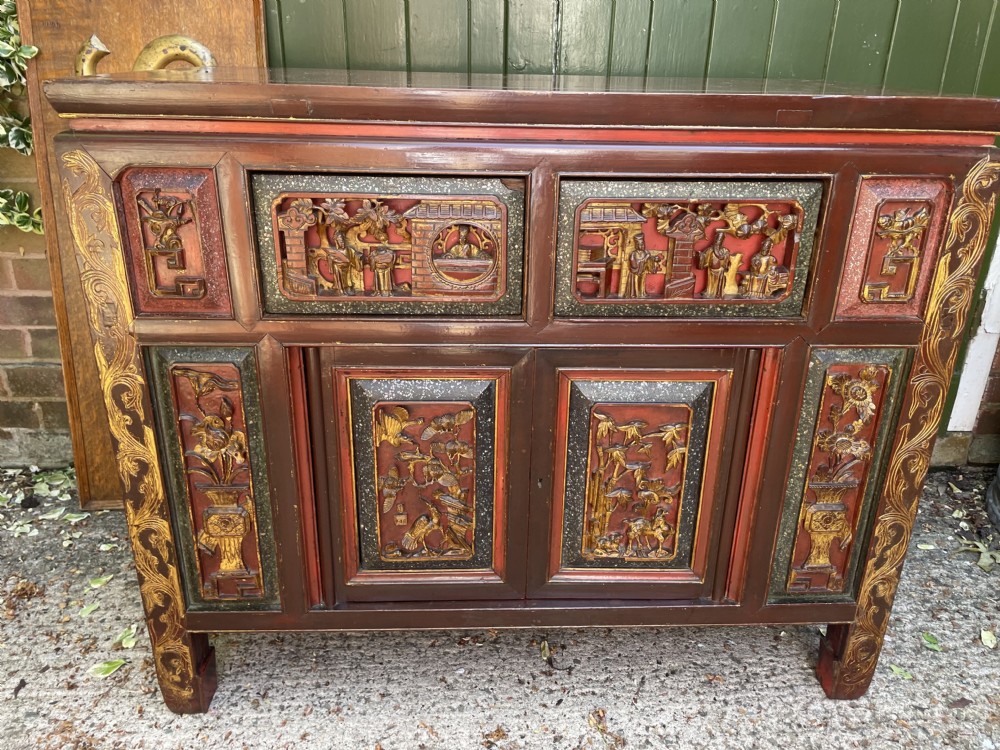 late c19th early c20th chinese qing dynasty carved gilded and red lacquered side cabinet