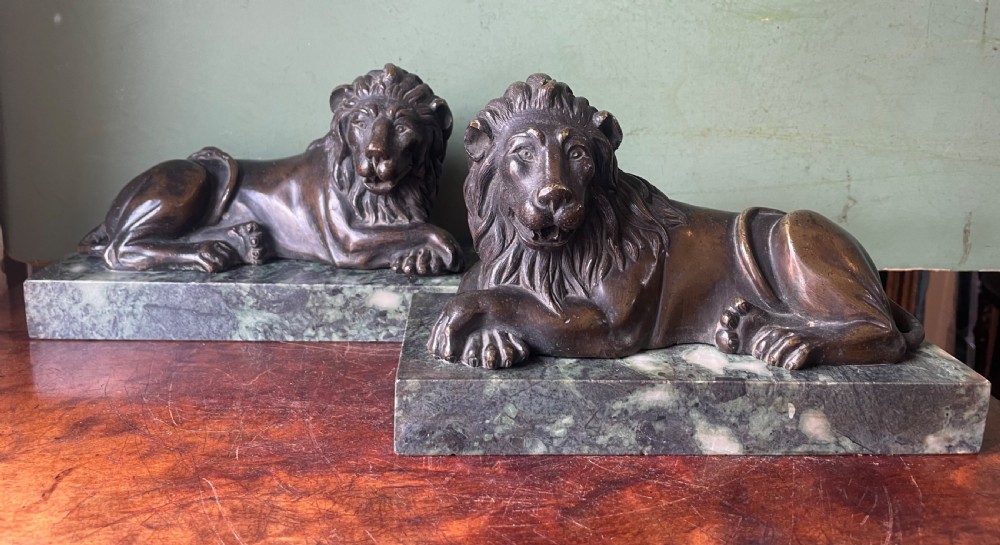 fine pair of early c19th regency period bronze lions mounted on verde antico marble plinth bases