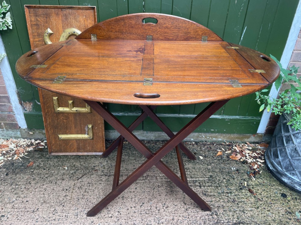 exceptionally large late c19th mahogany foldingsided oval countryhouse butlers tray on an xframe stand