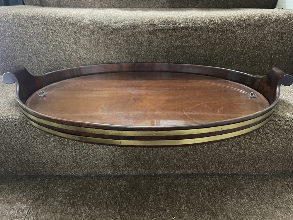 late c18th early c19th oval mahogany brassbound tray with a removable bespoke glass liner