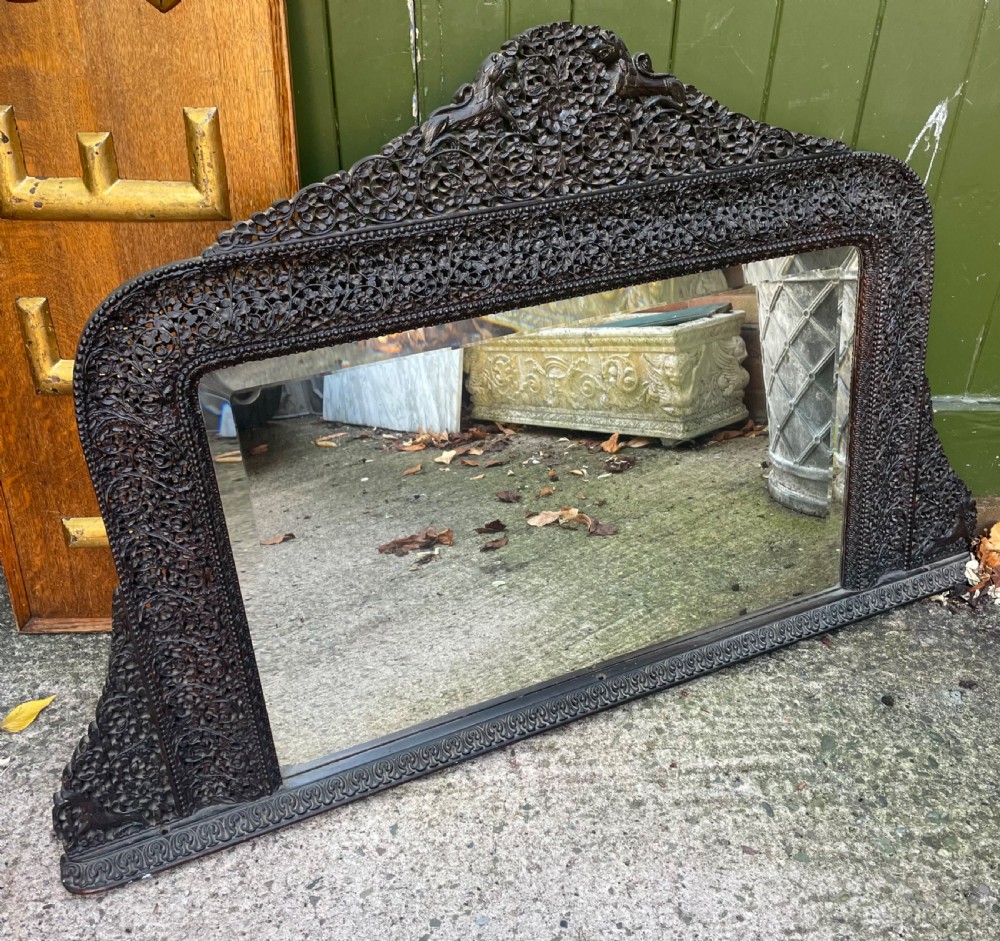 c19th carved indian or burmese blackwood framed overmantel mirror