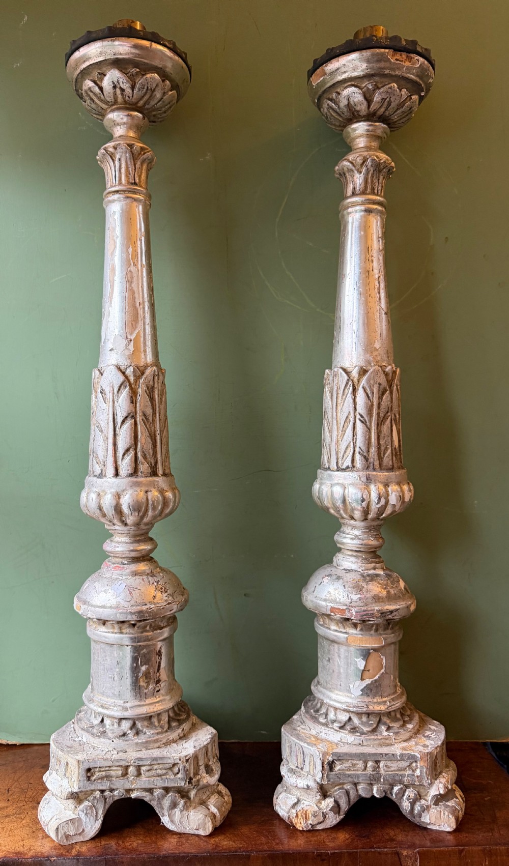 pair of late c18th early c19th italian silvered carved wooden altarstyle candlesticks