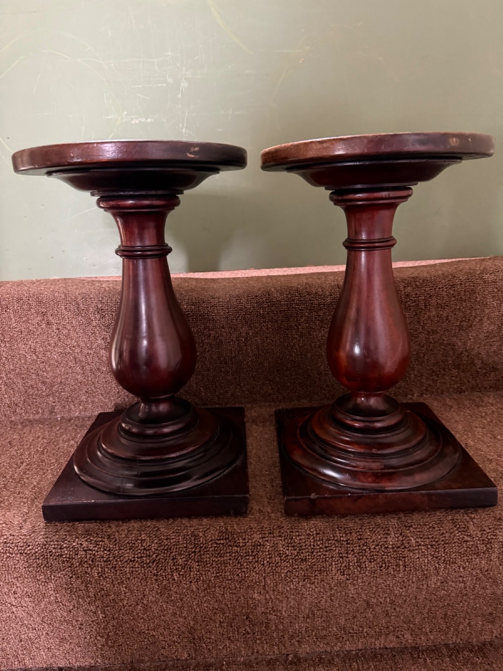 pair of early c19th mahogany sculpture or candle stands with circular dished tops on classical baluster supports