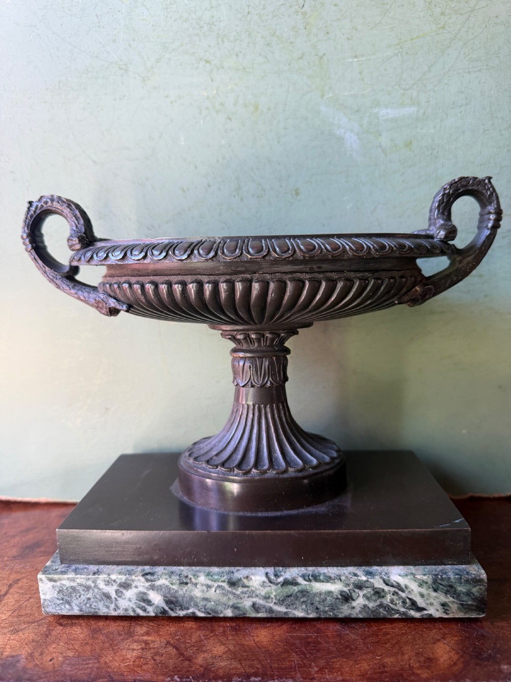 an early c19th george iv period bronze navetteshaped tazza mounted on an antico verde marble plinth base