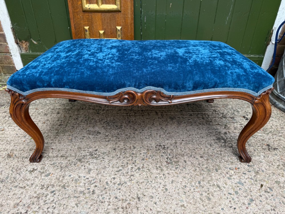 a mid c19th carved walnut framed centre stool of larger scale and proportions