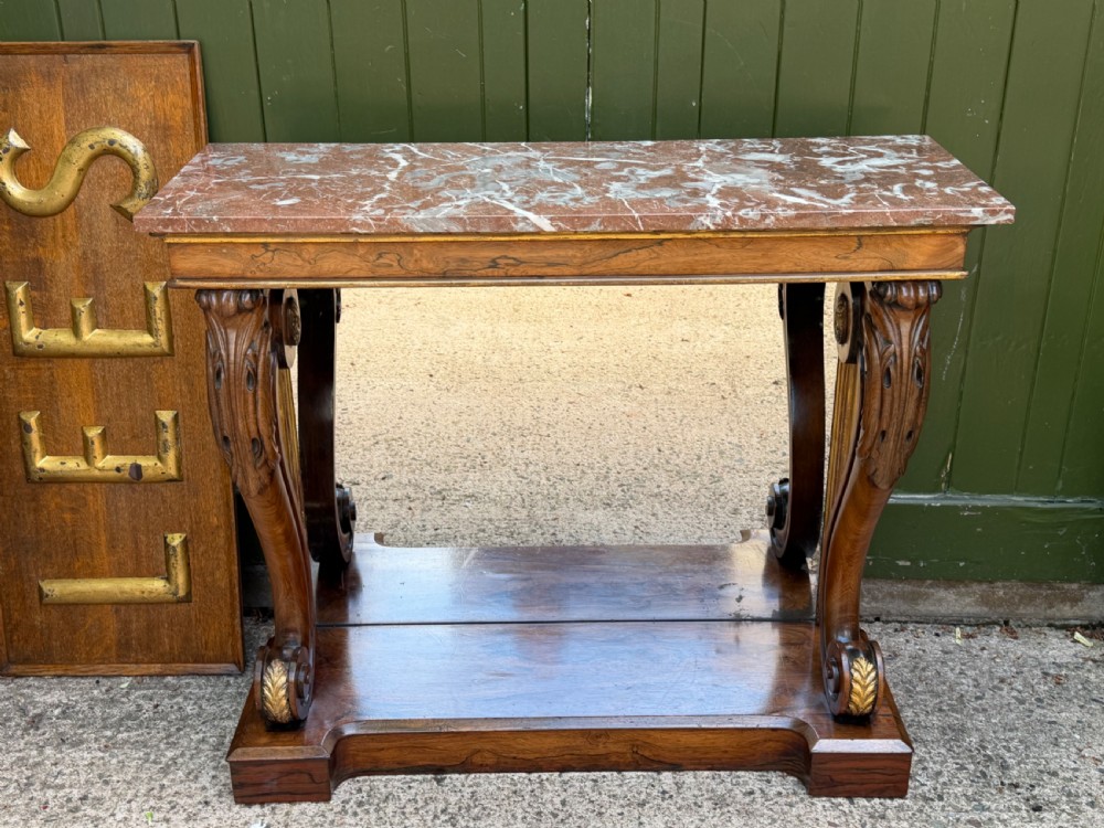 early c19th regency period rosewood and parcelgilt inset mirrorback console table with figured marble top
