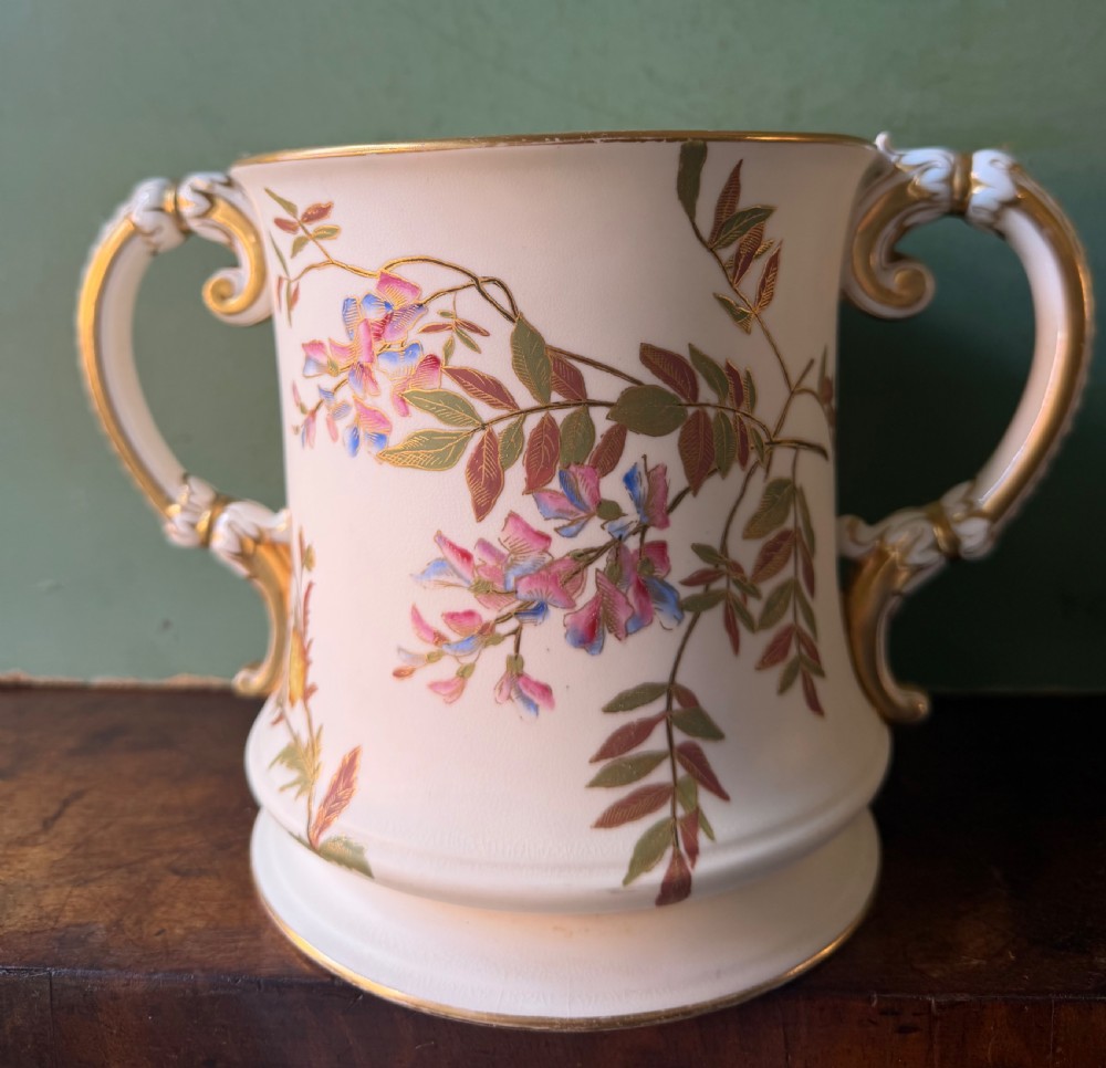 late c19th royal worcester porcelain twinhandled loving cup the pale ivory body with handpainted floral decoration