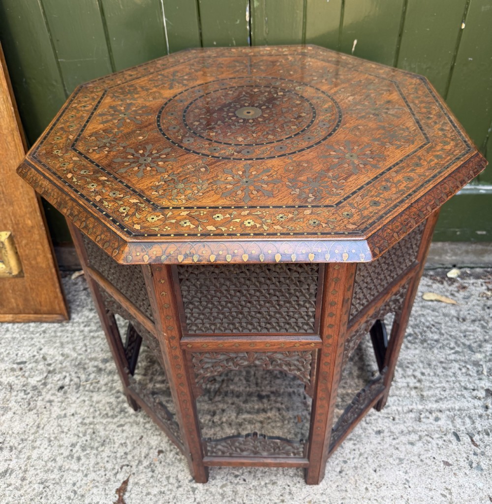 exceptional late c19th indian hoshiarpur brass and copper inlaid teak octagonal table on a folding carved and pierced base