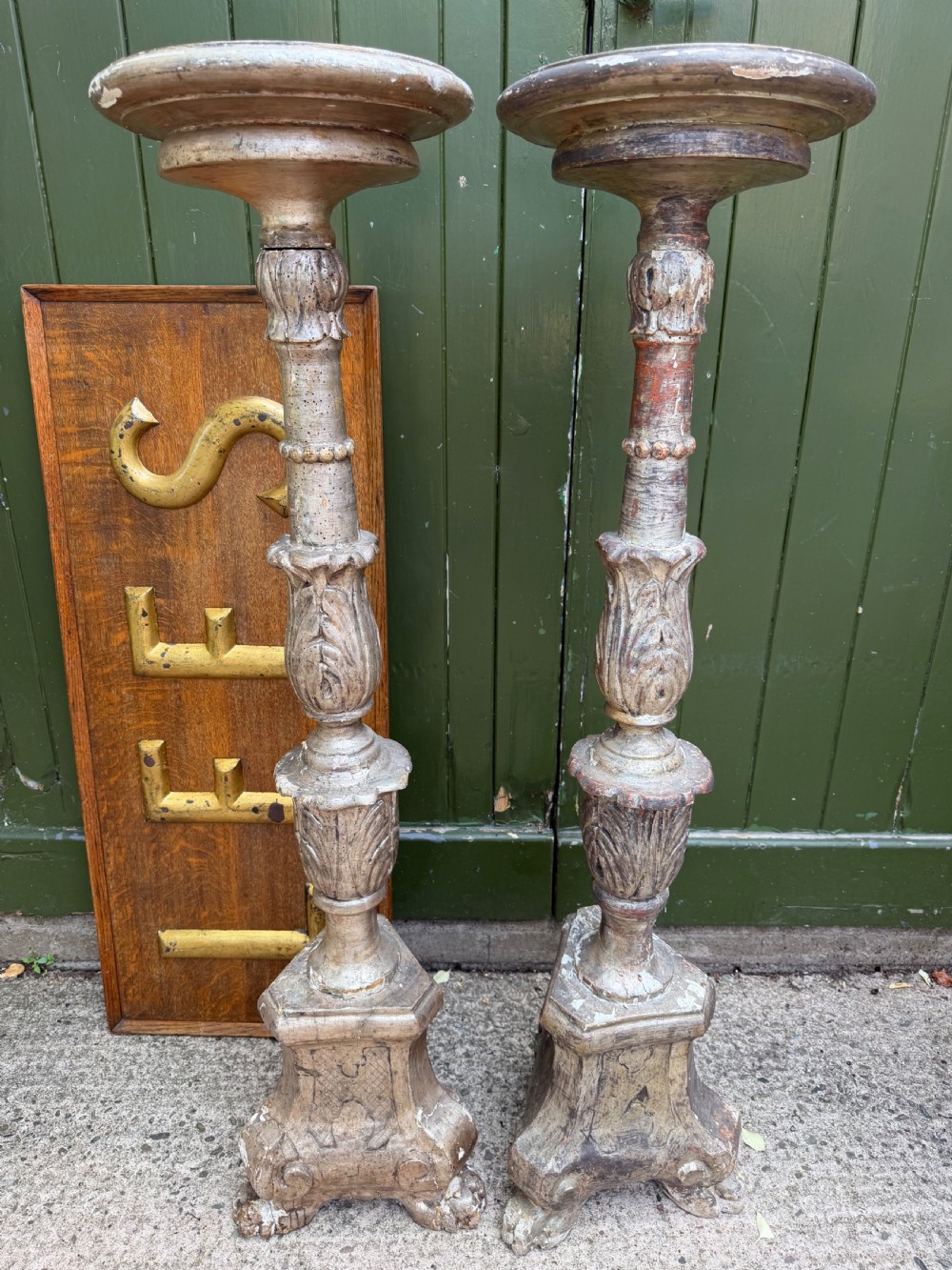 tall pair of c18th italian carved and silvered torcheres or candlestands