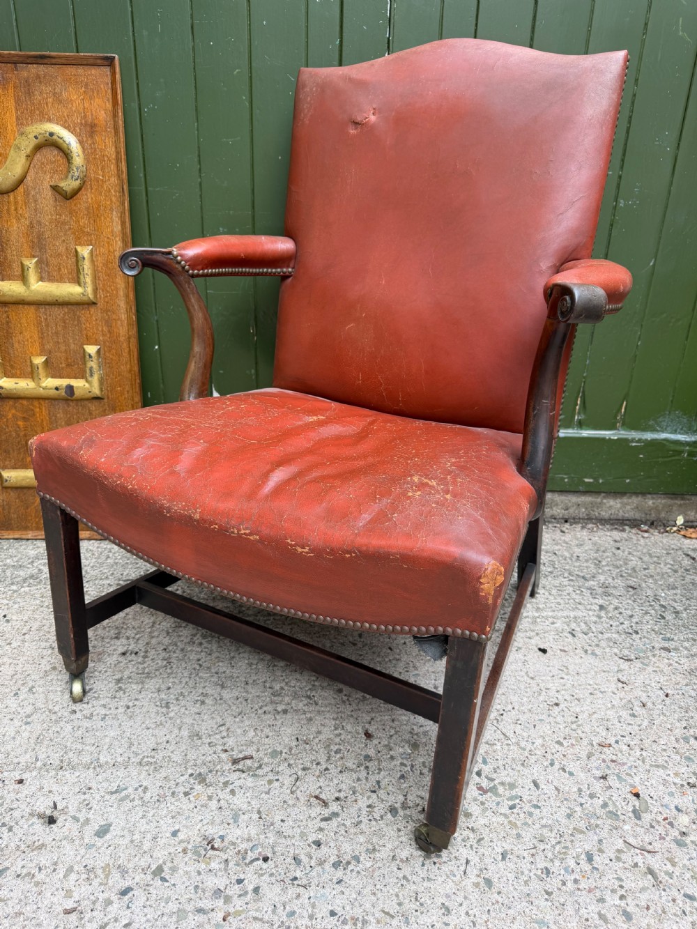 a large and overscaled c18th george iii period mahoganyframed gainsborough type library armchair upholstered in old red leather