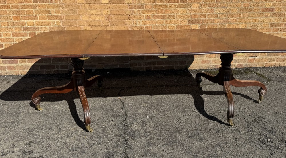 an elegant early c19th late george iii period twinpillar mahogany dining table of versatile form and practical scale
